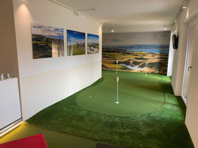 Asheville indoor putting green in an office with scenic wall art